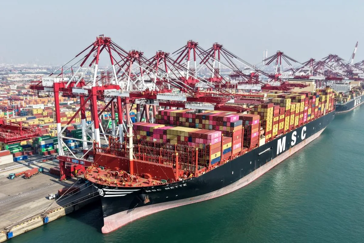 Container ship and gantry cranes at a major Chinese port
